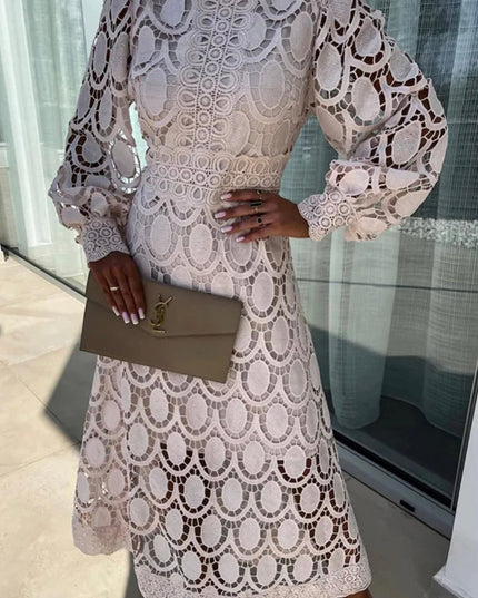 Elegant light pink long sleeve lace high neck midi dress featuring delicate circular cut-out designs