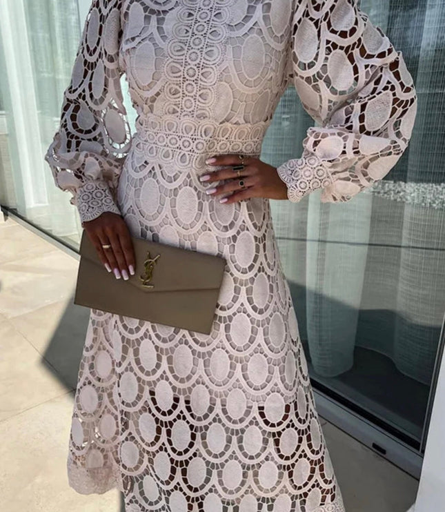 Elegant light pink long sleeve lace high neck midi dress featuring delicate circular cut-out designs
