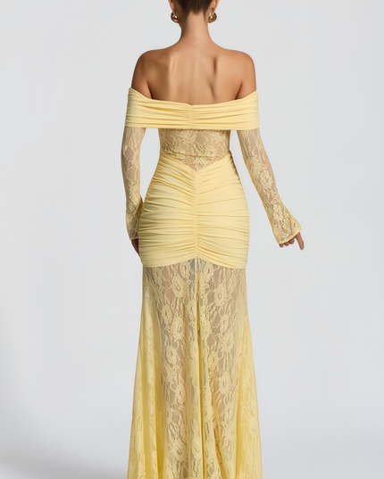 Back view of the women's yellow off-shoulder maxi dress, showing ruched details and sheer lace skirt.