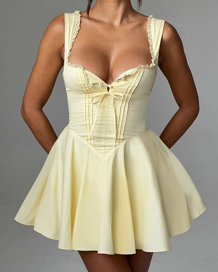 Close-up front view of a lemon yellow mini dress, highlighting the pintuck bodice and lace trim details.