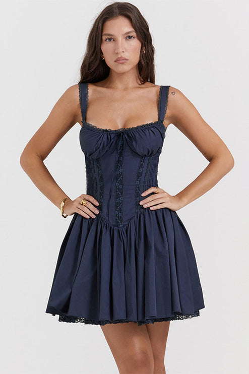 Navy sweetheart neck mini dress with lace-up corset bodice, smocked back, and delicate lace trim on the hem.