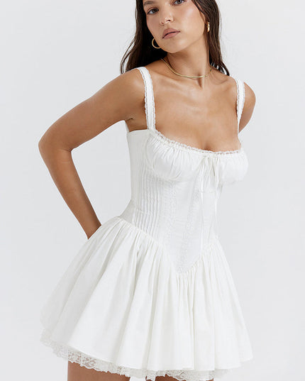 White sweetheart neck mini dress with a structured corset bodice, ruffled straps, and a flowy skirt with lace hem.