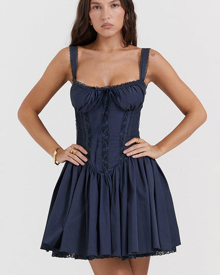 Full front view of a navy blue corset mini dress with a fitted bodice and a flared skirt, for a suit dress look.