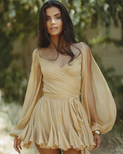 Light beige V-neck mini dress with long open sleeves, a wrap front, and a flounced skirt.
