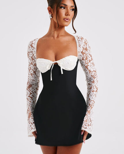 Three-quarter view of the black and white lace long sleeve mini dress, emphasizing the lace texture.