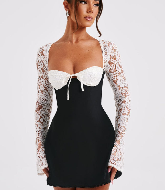 Three-quarter view of the black and white lace long sleeve mini dress, emphasizing the lace texture.