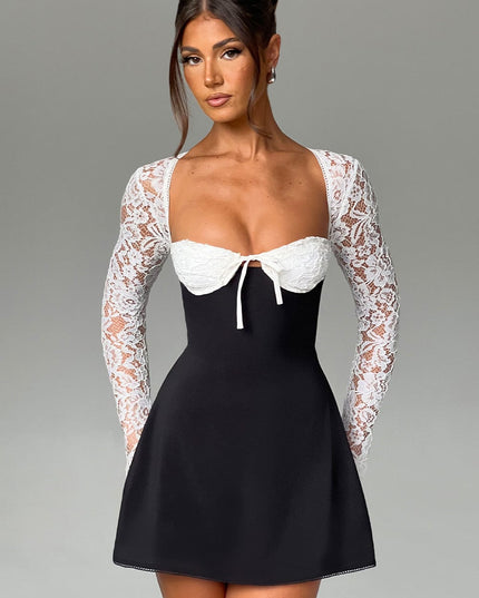 Front full shot of the black and white lace long sleeve mini dress, showcasing the overall design and fit.