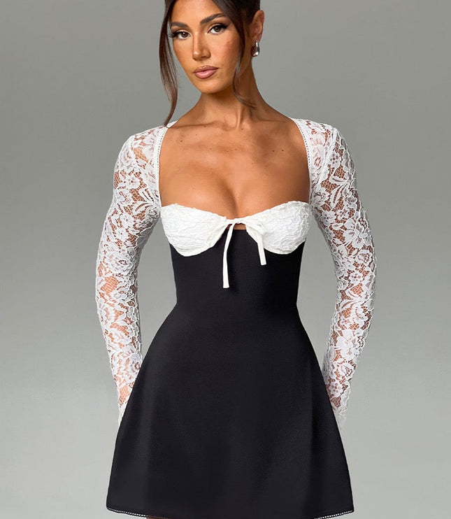 Front full shot of the black and white lace long sleeve mini dress, showcasing the overall design and fit.