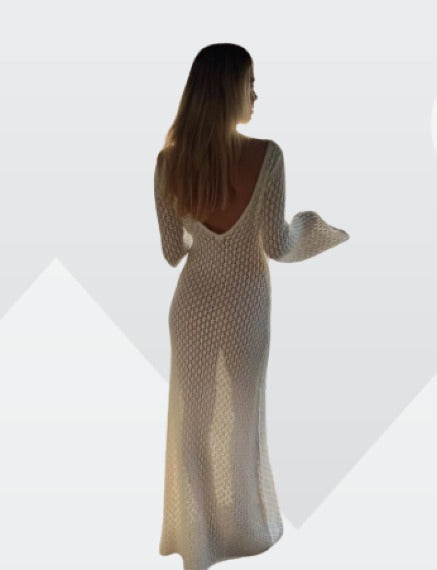 Back view of a white long sleeve crochet maxi dress with a low scoop back, highlighting the garment's fit.