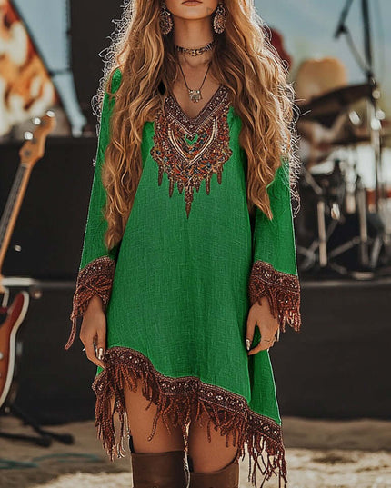 Women's emerald green embroidered V-neck long sleeve mini dress, detailed with brown fringe on the hem and sleeves.
