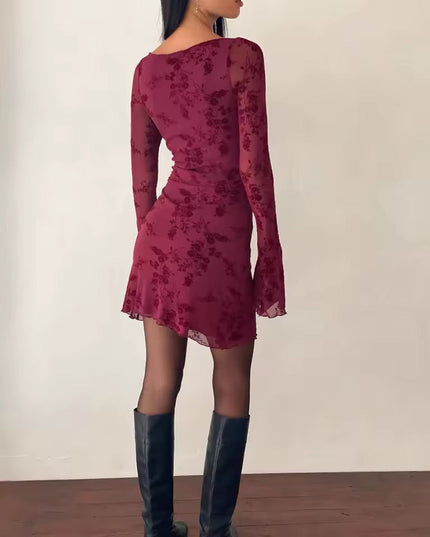 Back view of the maroon floral print long sleeve mini dress, showcasing the fitted silhouette and sheer bell sleeves.