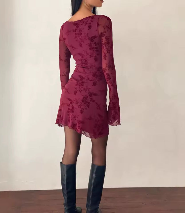 Back view of the maroon floral print long sleeve mini dress, showcasing the fitted silhouette and sheer bell sleeves.