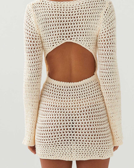 Back view of the cream long sleeve crochet mini dress, clearly showing the open back cut-out design.