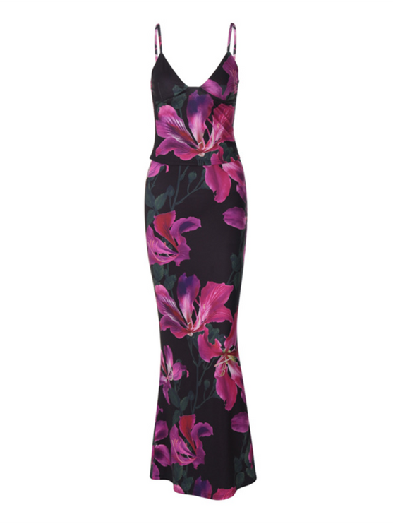 Full view of women's floral maxi dress in black with striking pink and purple flower pattern, fit.
