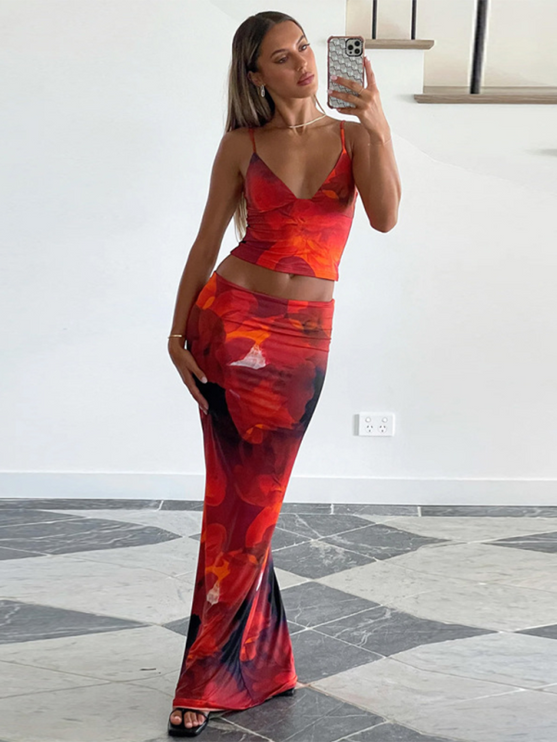 Women's red floral V-neck crop top and maxi skirt set, full length, with a vibrant red and orange flower print.