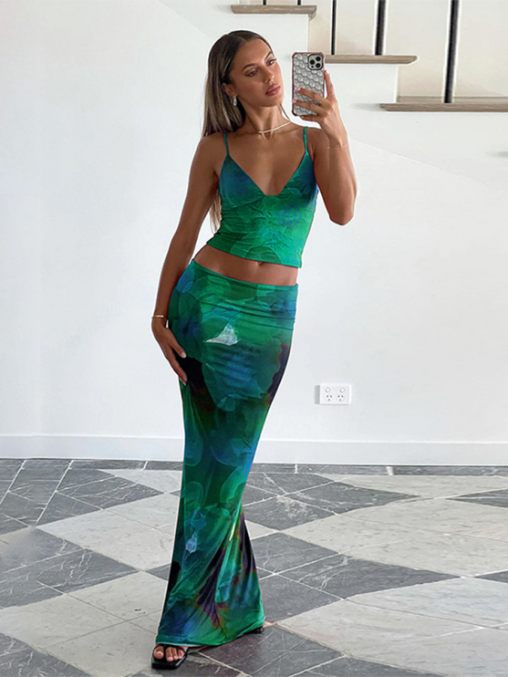 Women's green floral V-neck crop top and maxi skirt set, full length, with a green and blue flower print.