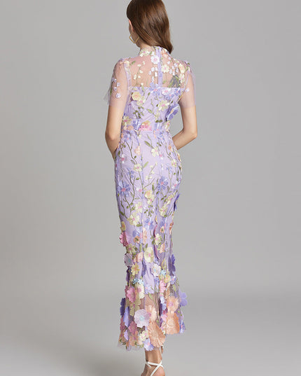 Back view of the lavender floral embroidered sheer maxi prom dress, highlighting the delicate embroidery and flowy silhouette.