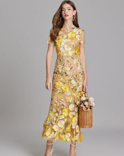 Women's yellow and white floral embroidered sheer maxi prom dress, short sleeves, with a basket of flowers.
