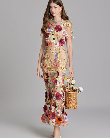 Front view of women's multi-color floral embroidered sheer maxi prom dress, short sleeves, with a flower basket.