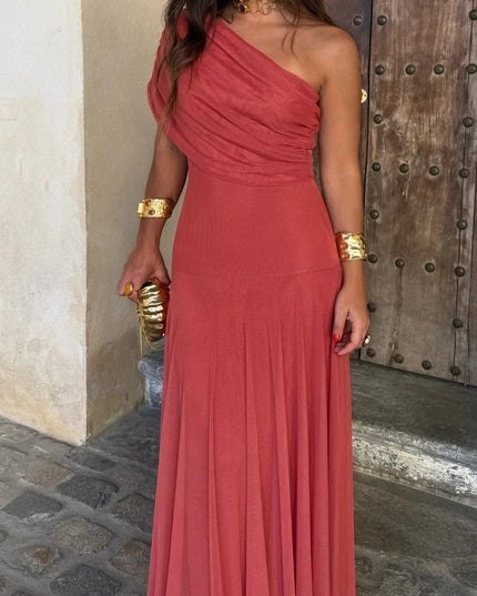 Women's coral red one shoulder drape mesh maxi dress, featuring a fitted bodice and flowing skirt.