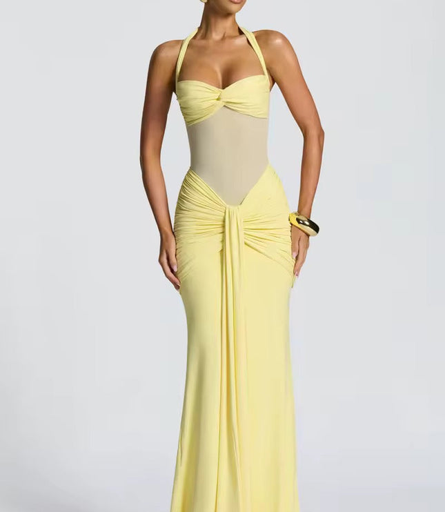 Women's light yellow prom halter neck ruched mesh maxi dress, designed with a sweetheart bust and a long, form-fitting skirt.