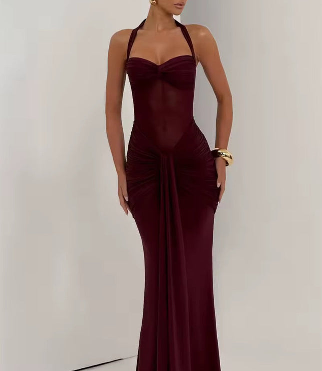 Full-length view of a women's prom halter neck ruched mesh maxi dress in a deep burgundy color, with a sweetheart neckline and knotted front detail.