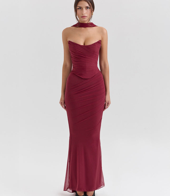Front view of a deep red strapless mesh ruched maxi dress with a choker detail