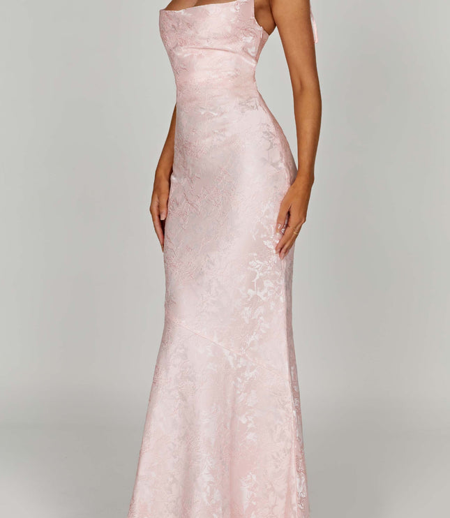 Side angle of the women's pink floral maxi dress with tie straps, highlighting the fitted bodice and flowing skirt.
