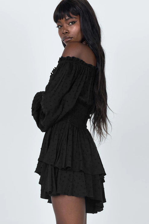 Black off-shoulder mini dress with long puff sleeves and tiered ruffled skirt detail