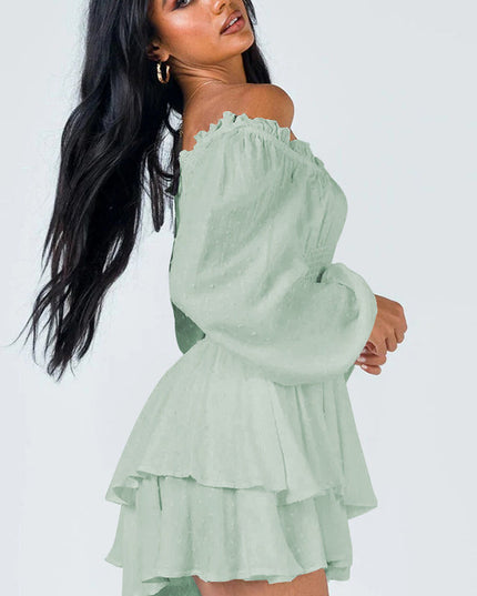 Side profile of a women's light green off-shoulder mini dress with textured fabric and tiered skirt detail.