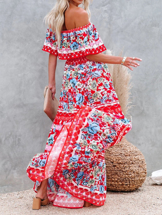 Dynamic shot of a red floral off-shoulder ruffled maxi dress with blue flowers, flowing gracefully in motion.