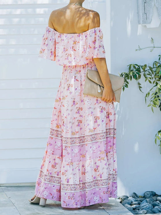 Back view of light pink floral off-shoulder ruffled maxi dress, showing the tiered skirt and pattern details.