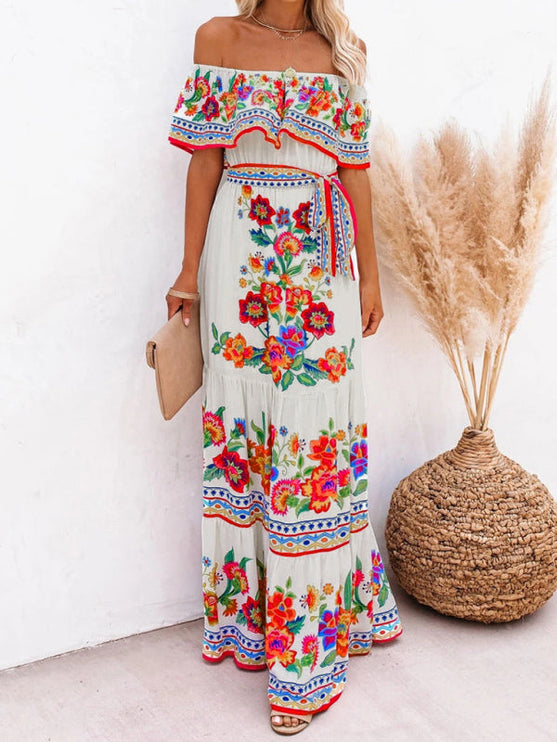 Women's white off-shoulder maxi dress with bright floral patterns and a tiered skirt, for a casual look.