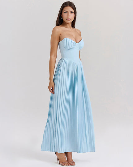 Side view of a light blue strapless pleated maxi dress, showcasing the elegant pleats and fitted bodice.