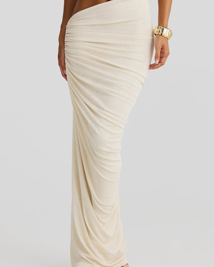Close-up of the draped off-white maxi skirt from the two-piece set, highlighting the side cut-out and ruched fabric texture.
