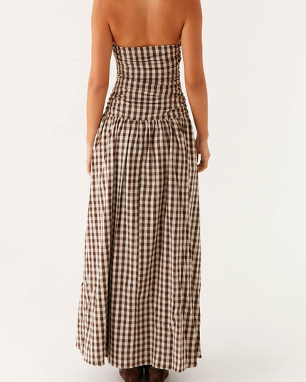 Back view of women's brown and white gingham strapless ruched maxi dress, full length
