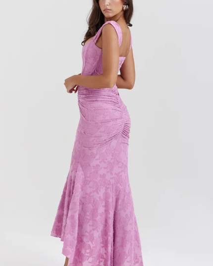 Rear side view of the pink floral ruched off-shoulder maxi dress, emphasizing the ruching on the back and high-low hem.