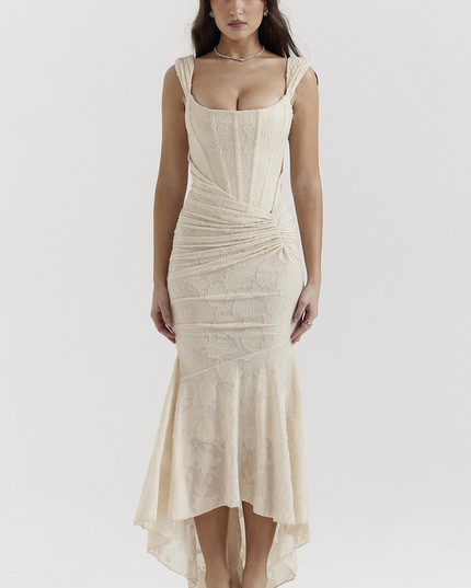 Front view of a cream floral ruched maxi dress with structured shoulder straps and a mermaid silhouette.
