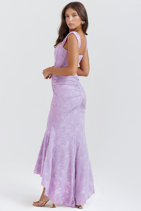 Rear side view of the light purple floral ruched off-shoulder maxi dress, highlighting the back ruching and textured floral pattern.