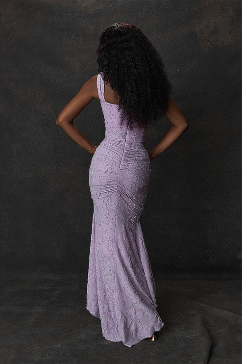 Back view of the women's light lavender floral ruched maxi dress, showing the fitted bodice and flowing mermaid skirt.