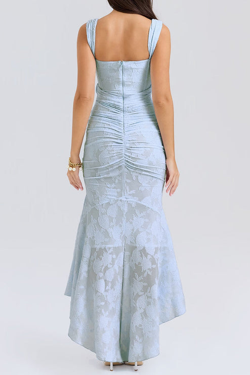 Rear view of the women's light blue floral ruched maxi dress, displaying the intricate ruched back and high-low hem.