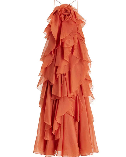 Full product shot of a coral strapless ruffle layered maxi dress, featuring delicate spaghetti straps and an intricate floral bust detail, for prom.