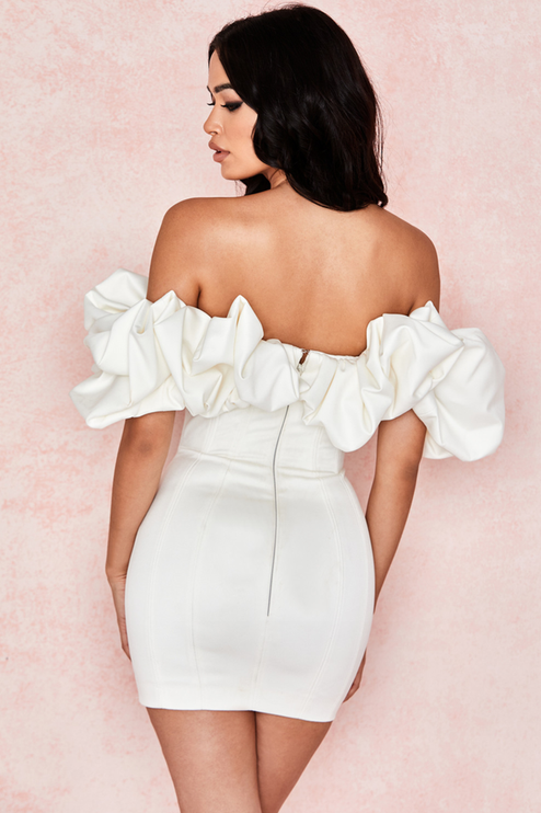 Detailed back view of the white off-shoulder ruffle satin mini dress, featuring a visible zipper closure and tailored fit.