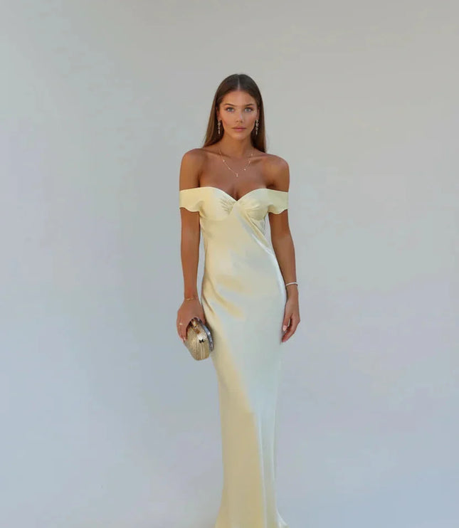 Front view of a women's elegant light yellow satin maxi dress with off-shoulder sleeves and a fitted bodice, ideal for special occasions.