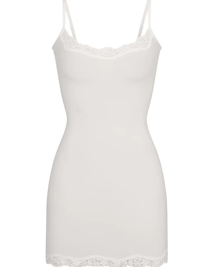 White women's lace trim scoop neck mini slip dress, showcasing the intricate lace along the neckline and hem.