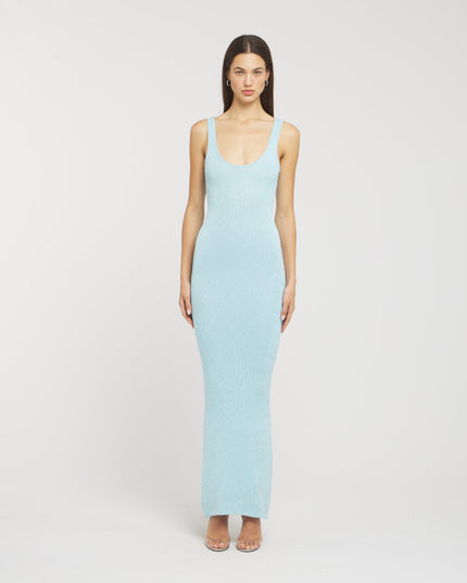 Front view of a light blue sleeveless scoop neck sequin maxi dress, form-fitting, with a subtle shimmer, paired with silver heels.