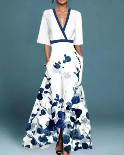 Women's white floral v-neck maxi dress with short sleeves and blue abstract floral print, with pockets visible.