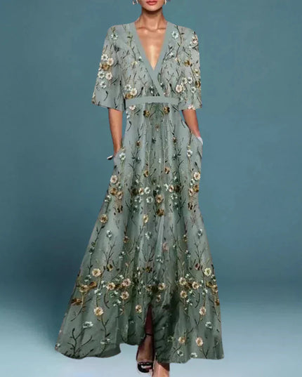 Women's gray floral v-neck maxi dress with short sleeves and pockets, featuring an embroidered floral pattern.