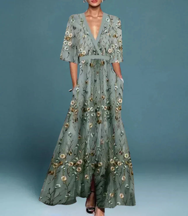 Women's gray floral v-neck maxi dress with short sleeves and pockets, featuring an embroidered floral pattern.
