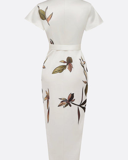 Back view of the white leaf print v-neck short sleeve midi wrap dress, highlighting the leaf pattern and waistline.
